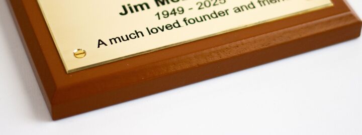 Close up of brass plaque with tricoya base